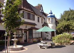 A pleasant courtyard with shaded seating in Crossroads Continental Village.