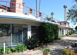 Rounded corners, red railings and blue tiles are some of the Streamline Moderne features on the Crossroads ocean liner.