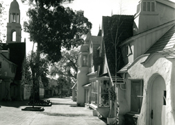 Looking south from the Continental Village at Crossroad's opening in 1936. Note the Blessed Sacrament Church Tower, which has since been replaced.